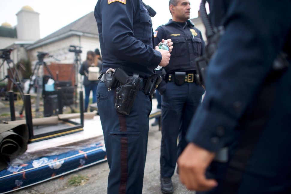New Jersey police officers at a crime scene in Paterson, N.J.