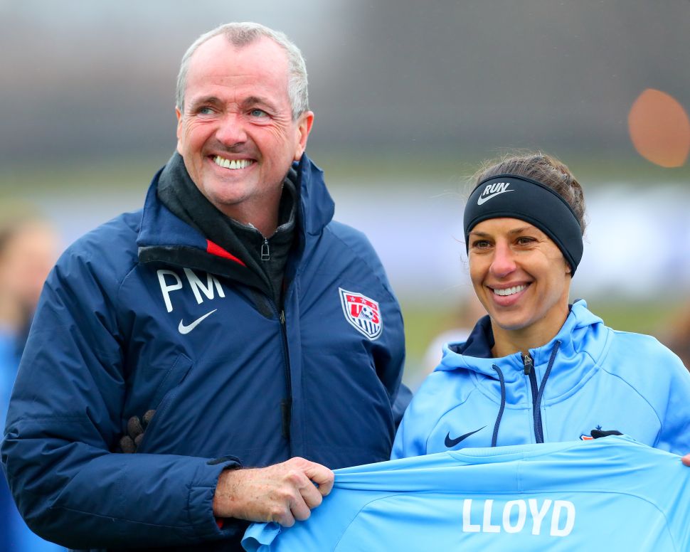 Sky Blue FC midfielder Carli Lloyd (10) poses for a photo with New Jersey Governor Phil Murphy in recognition of her 100th Goal prior to the first half of the National Womens Soccer League game between Sky Blue FC and Seattle Reign FC on April 15, 2018, at Yurcak Field in Piscataway, NJ.