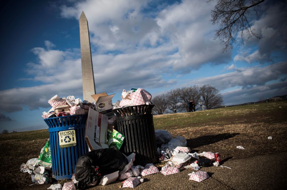 Litter spills out of a public dustbin next to the Washington Monument on the National Mall in Washington, D.C. on December 24, 2018.