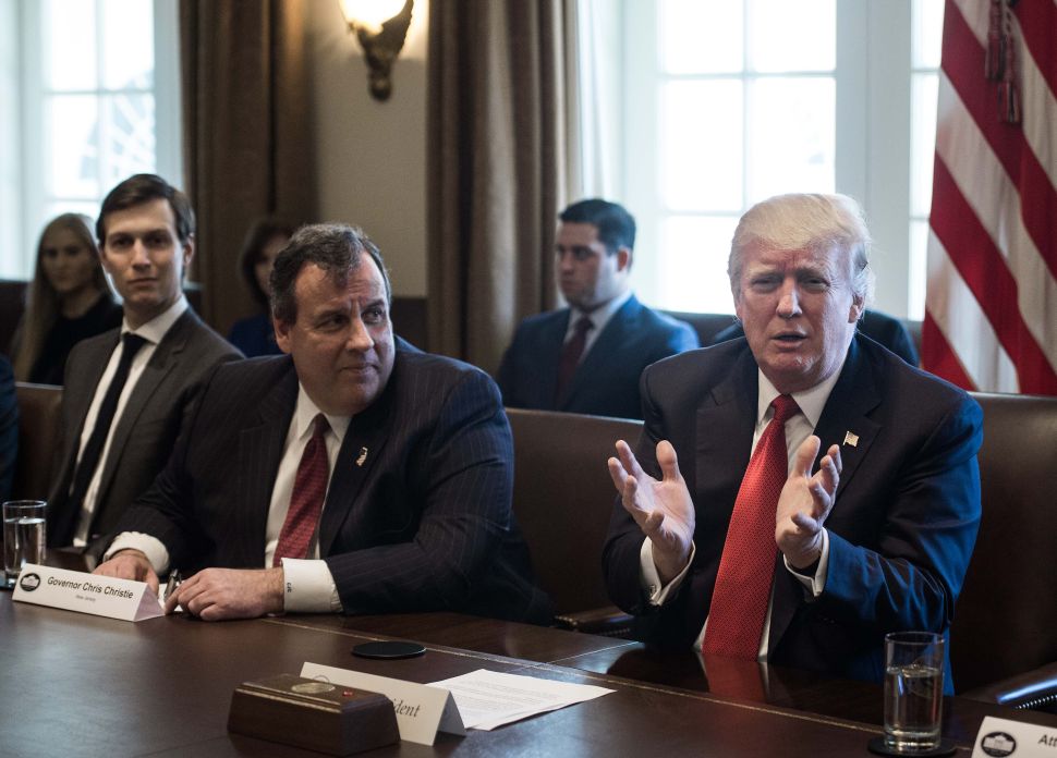 President Donald Trump speaks as Former Governor Chris Christie (C) and senior adviser Jared Kushner (L) look on during a meeting about opioid and drug abuse in the Cabinet Room at the White House in Washington, DC, on March 29, 2017.