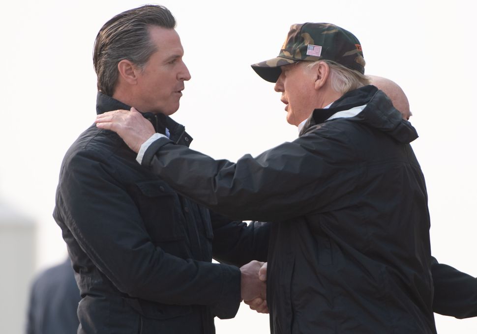 President Donald Trump greets California Governor Gavin Newsom.