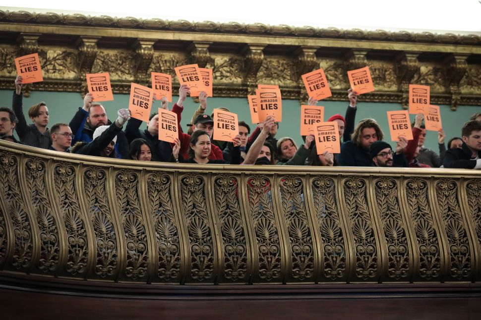Protestors interrupt a New York City Council Finance Committee hearing titled 'Amazon HQ2 Stage 2: Does the Amazon Deal Deliver for New York City Residents?' at New York City Hall, on January 30, 2019.