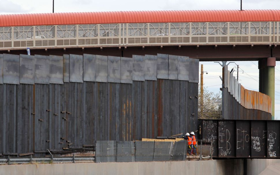 U.S. workers build the border wall between El Paso, Texas and Ciudad Juarez, Mexico on February 5, 2019. 