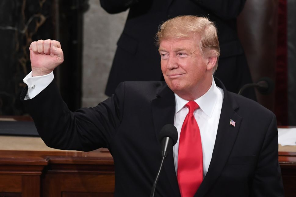 U.S. President Donald Trump gestures as he delivers the State of the Union address.