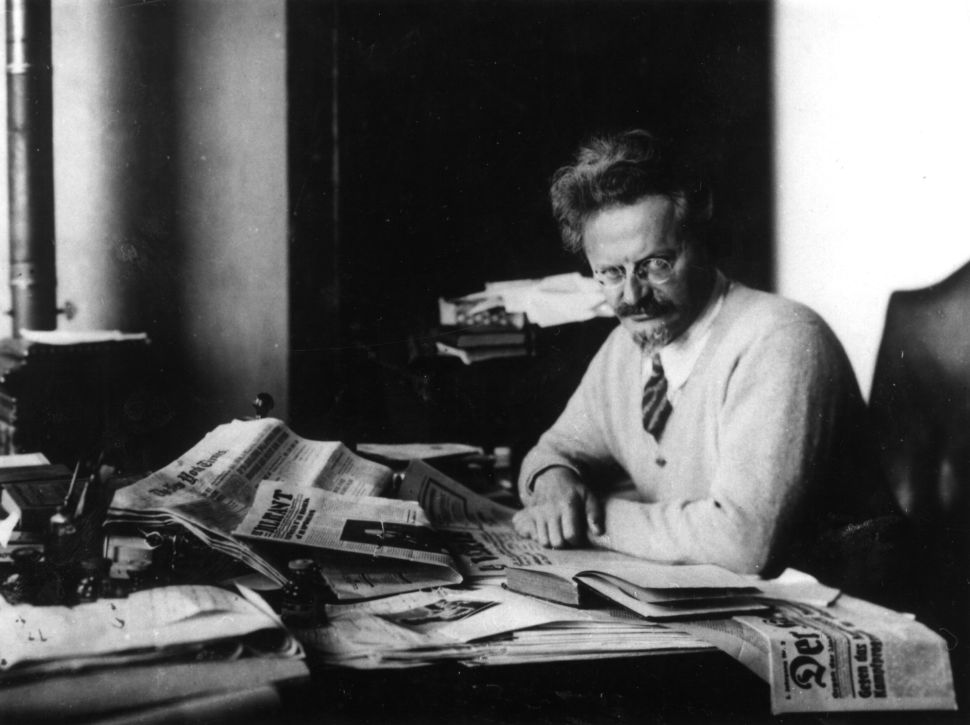 Russian revolutionary Leon Trotsky (1879 - 1940) working on his book 'The History of the Russian Revolution' in his study at Principe, Gulf of Guinea.