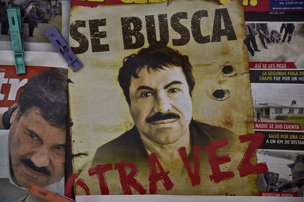 A poster with the face of Mexican drug lord Joaquin "El Chapo" Guzman.