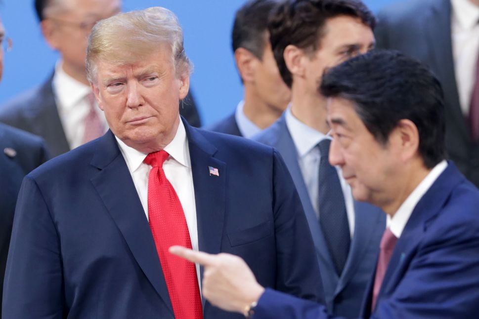 President Donald Trump looks at Prime Minister of Japan Shinzo Abe.