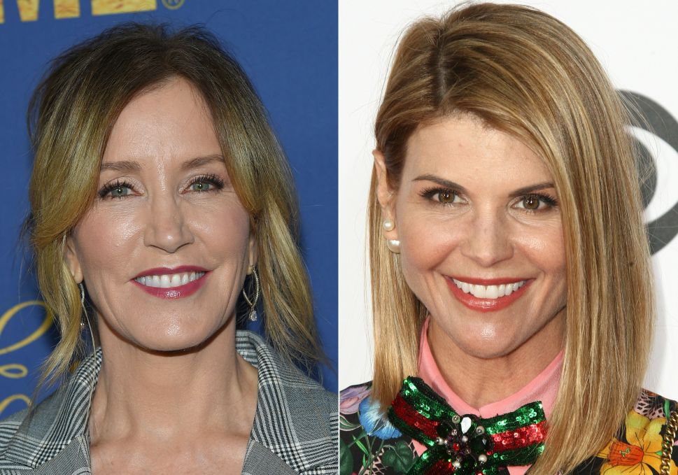 Actresses Felicity Huffman (L) and Lori Loughlin are among 50 people indicted in a nationwide university admissions scam, court records unsealed in Boston on March 12, 2019 showed.