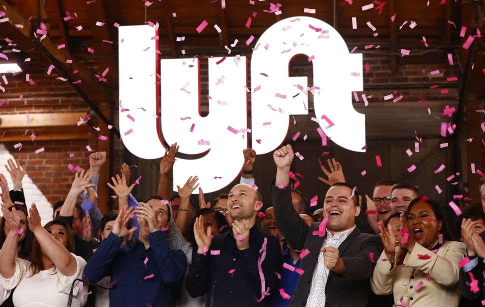 Lyft executives and employees ring the Nasdaq opening bell celebrating the company's IPO on March 29.