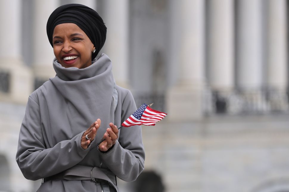 Rep. Ilhan Omar (D-Minn.) rallies with fellow Democrats before voting on H.R. 1.