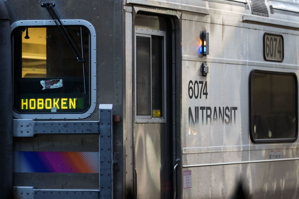 A New Jersey Transit train arrives at Hoboken Terminal during morning rush hour.
