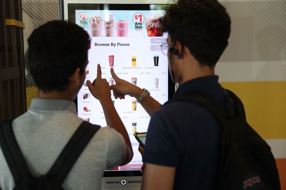 McDonald's is investing in AI technology to encourage customers to order more.