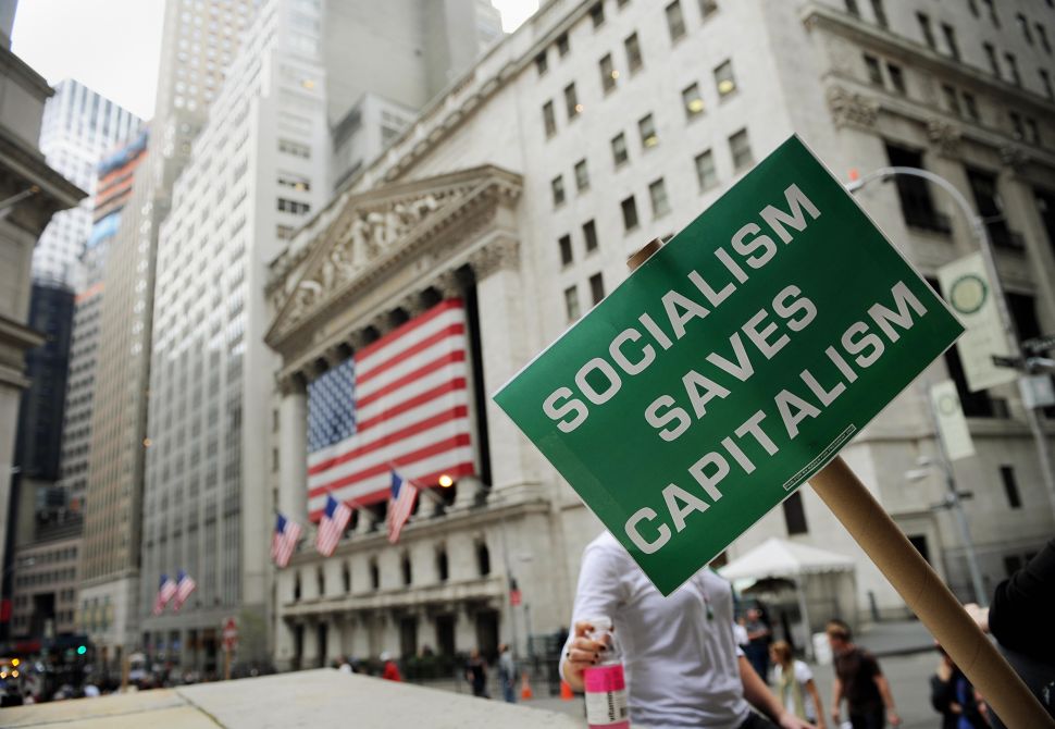A sign provides a commentary on the U.S. government bailout of banks on October 16, 2008 in front of the New York Stock Exchange.