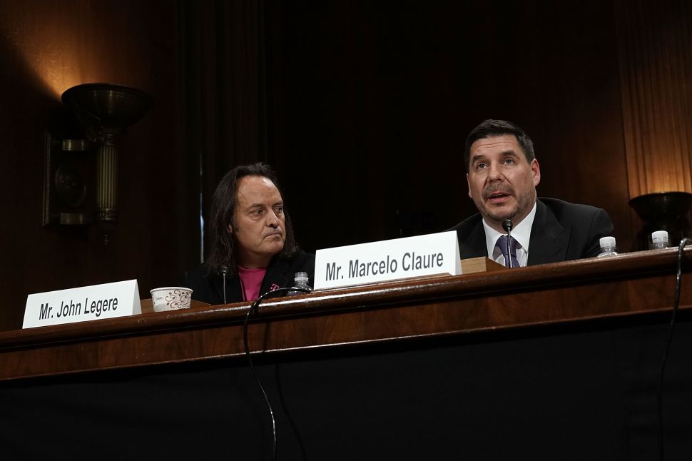 CEO of T-Mobile US Inc. John Legere (L) and Executive Chairman of Sprint Corporation Marcelo Claure (R) testify during a hearing before the Antitrust, Competition Policy and Consumer Rights Subcommittee of Senate Judiciary Committee on June 27, 2018.