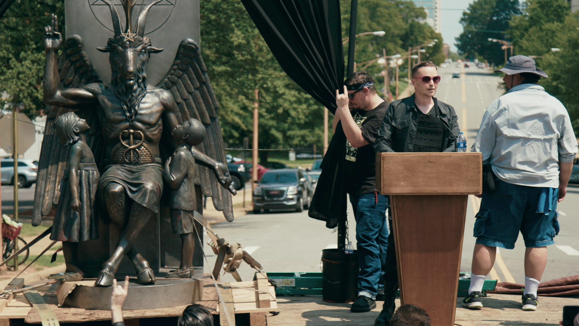 Lucien Greaves delivering a speech in front of the State Capitol building in Little Rock, Ark., in Hail Satan?