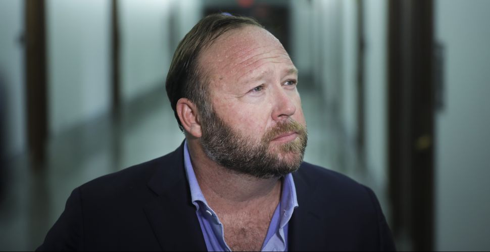 Alex Jones of InfoWars talks to reporters outside a Senate Intelligence Committee hearing concerning foreign influence operations' use of social media platforms, on Capitol Hill, September 5, 2018.