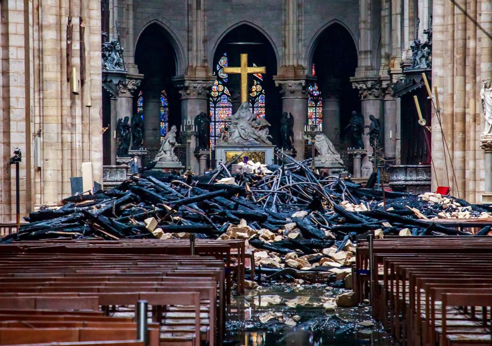 The debris inside the Notre Dame Cathedral a day after a fire devastated the building in the French capital.