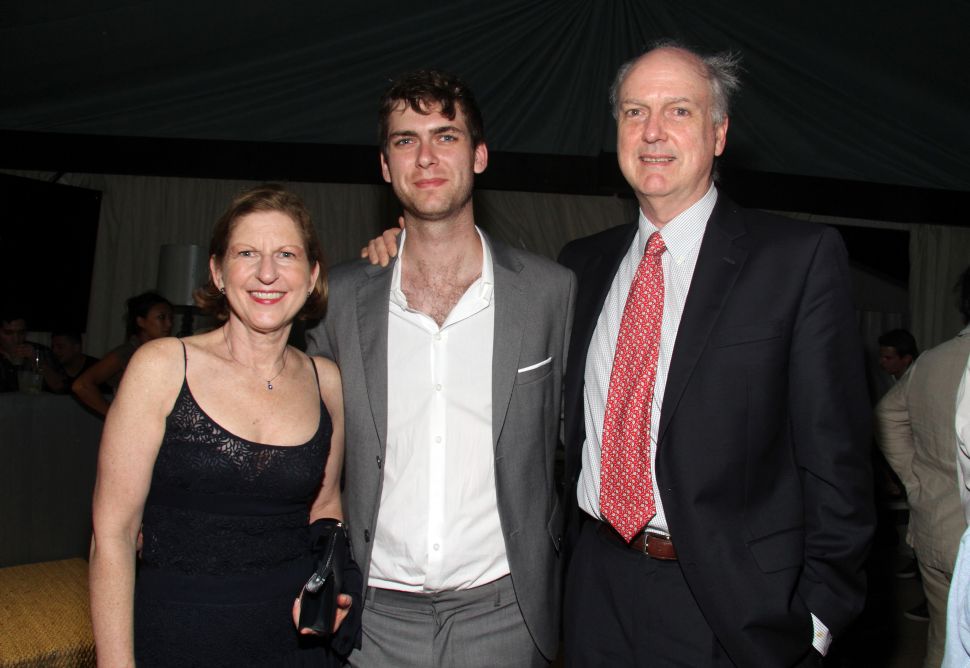 Carter Cleveland (M) with his mother, Patricia Cleveland and father, David Adams Cleveland at an Artsy event in December 2013.