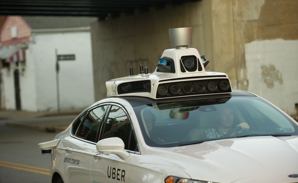 An Uber driverless Ford Fusion takes a test drive in Pittsburgh.