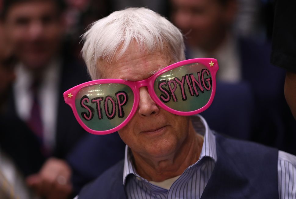 Protesters attend the hearing where Facebook co-founder, chairman and CEO Mark Zuckerberg testified before a combined Senate Judiciary and Commerce committee hearing on April 10, 2018 in Washington, D.C.
