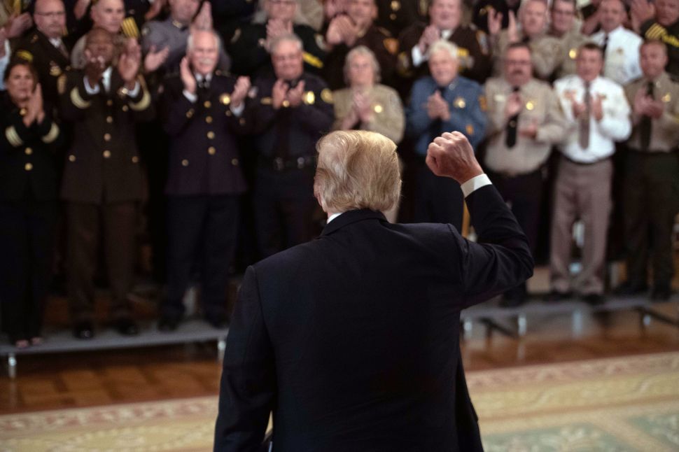 President Donald Trump is applauded by sheriffs from across the U.S.