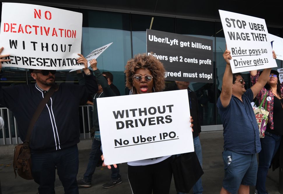 Rideshare drivers for Uber and Lyft stage a strike and protest at the LAX International Airport, over what they say are unfair wages in Los Angeles, California on May 8, 2019.