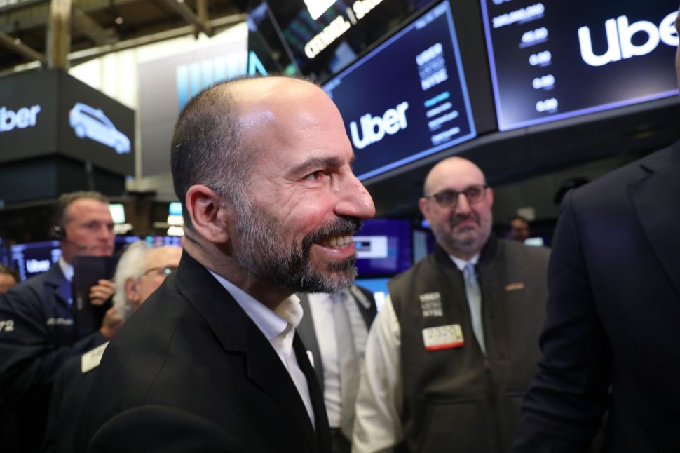 Uber CEO Dara Khosrowshahi walks the floor of the New York Stock Exchange after Uber's public debut.