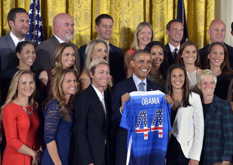 U.S. President Barack Obama poses for group photos with members of the U.S. Women's National Soccer Team during a ceremony to honor them and their victory in the 2015 FIFA Women's World Cup at the East Room of the White House on Oct. 27, 2015.
