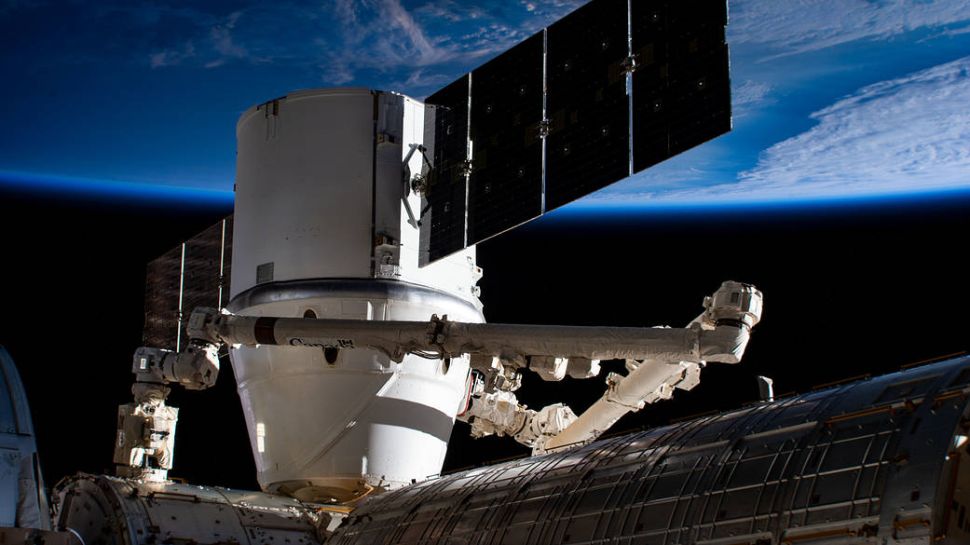 The SpaceX Dragon resupply ship is pictured berthed to the Harmony module as the International Space Station orbited 258 miles above east Asia.