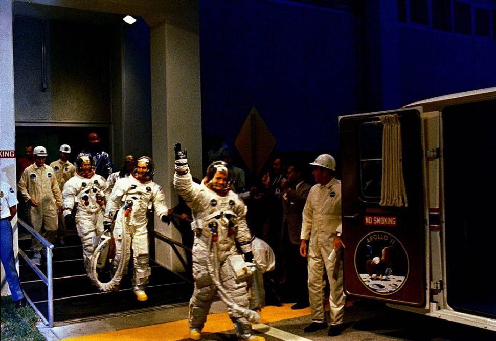 The Apollo 11 crew leaves Kennedy Space Center's Manned Spacecraft Operations Building during the pre-launch countdown.