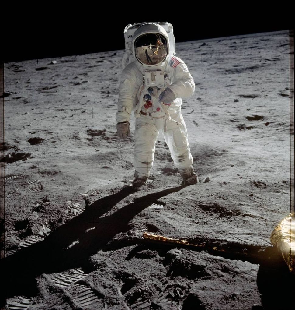 Astronaut Buzz Aldrin walks on the surface of the moon near the leg of the lunar module Eagle during the Apollo 11 mission. Mission commander Neil Armstrong took this photograph with a 70mm lunar surface camera.