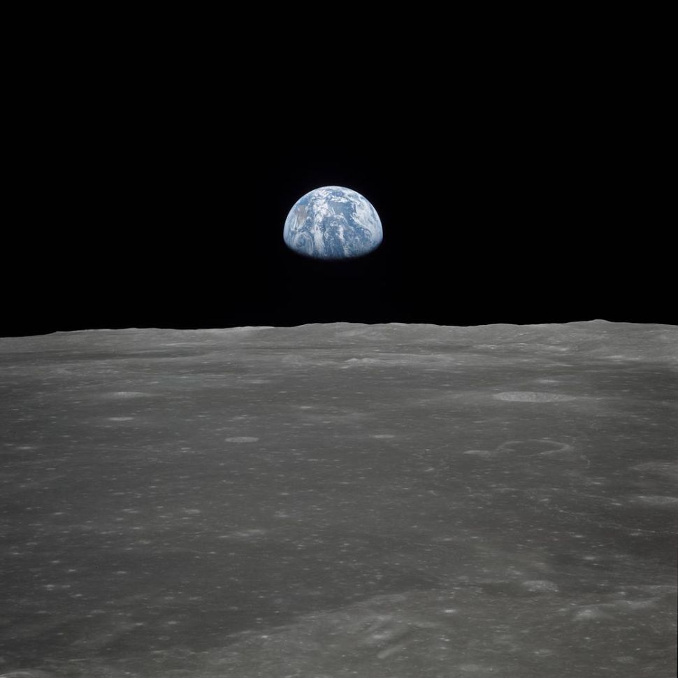 This view of Earth rising over the Moon's horizon was taken from the Apollo 11 spacecraft.