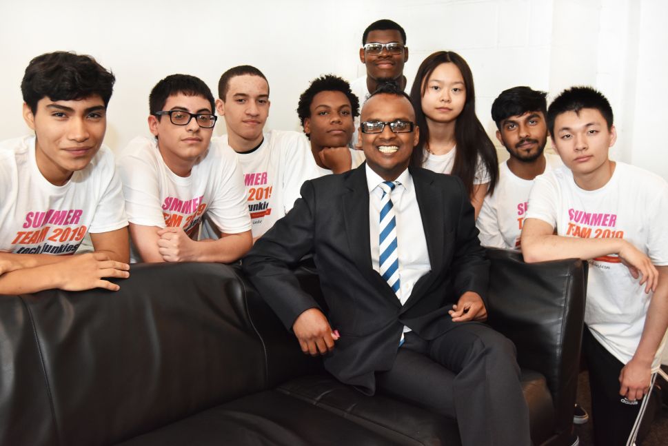 Nelson Nigel, center, founder of Kidmoto Technologies and summer interns at the NYDesigns office in Long Island City, Queens. Interns left to right: Victor Martinez, Sebastian Silguero, Wilber Garcia, Jaydon Felix, Kyle Smith, Shelly Lin, Nur Mazumder and Jack Wang