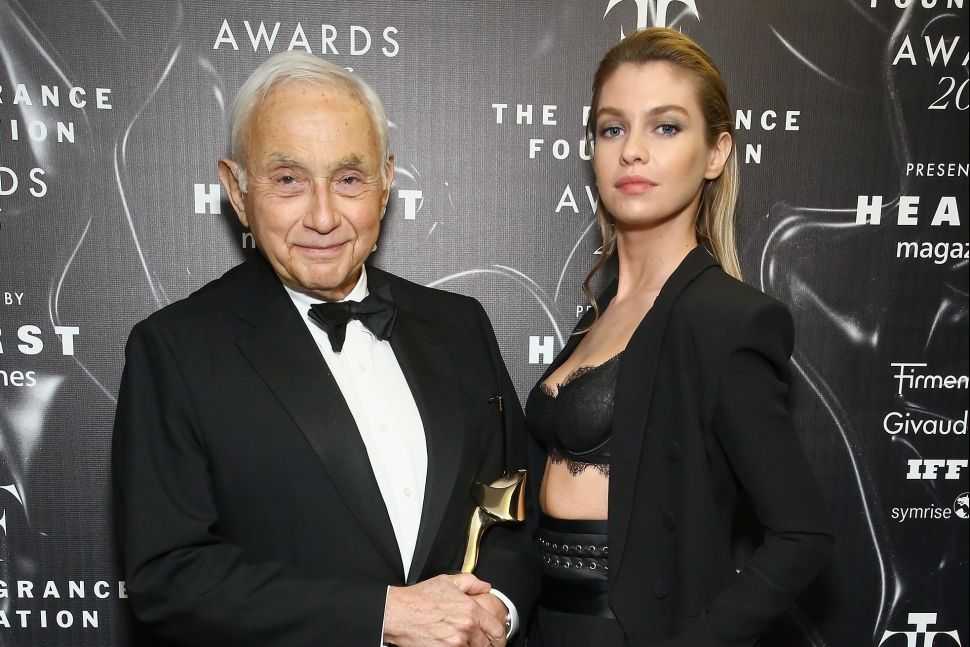 Les Wexner (L) and Victoria's Secret model Stella Maxwell at the 2016 Fragrance Foundation Awards presented by Hearst Magazines in New York City.