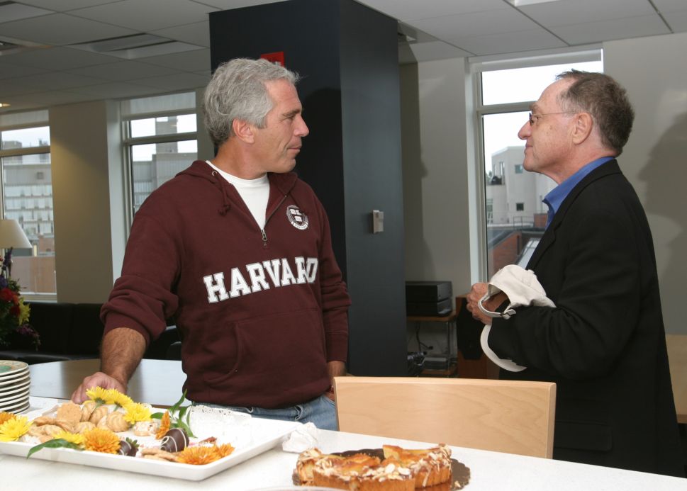 Jeffrey Epstein (L) seen with Harvard law professor Alan Dershowitz, who represented him in 2007 during a case accusing Epstein of sex trafficking minors.