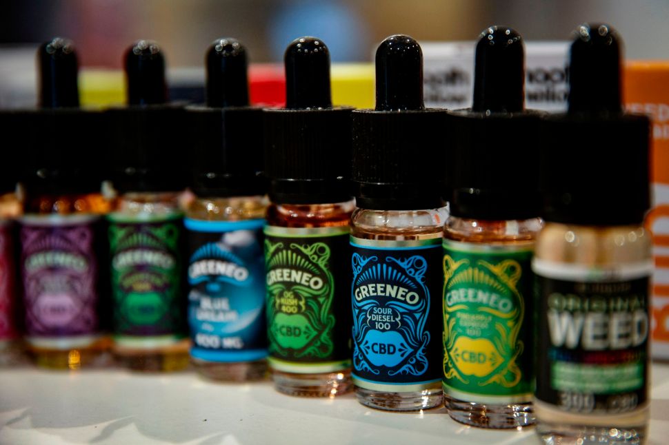 E-liquids containing CBD are seen in a shop in the Paris area on June 14, 2018.
