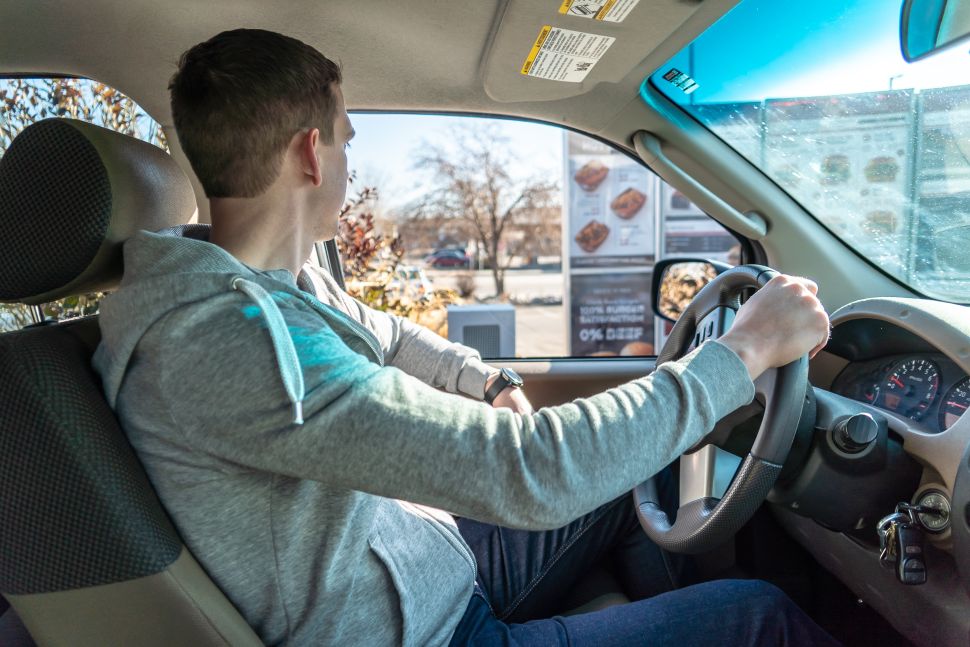 Valyant AI founder and CEO Robert Carpenter shows off 'Holly' in action at a drive-thru window.