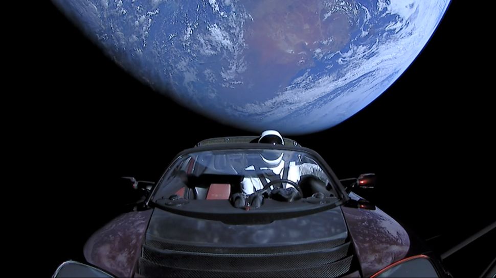 In this handout photo provided by SpaceX in February 2018, a Tesla Roadster launched from the Falcon Heavy rocket with a dummy driver named "Starman" heads toward Mars.