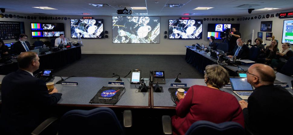 NASA administrator Jim Bridenstine, NASA management and members of Congess watch the beginning of the first all-woman spacewalk on Friday, Oct. 18, 2019, from the Space Operations Center at NASA headquarters in Washington.