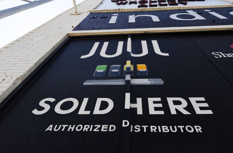 A sign advertises Juul vaping products in Los Angeles, Calif.