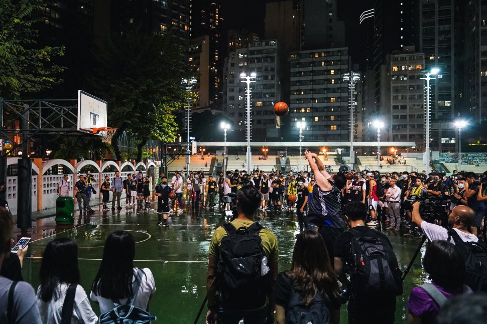 Hundreds of basketball fans gather to show support of the Houston Rockets general manager, Daryl Morey, and NBA commissioner Adam Silver, on October 15, 2019 in Hong Kong, China. 