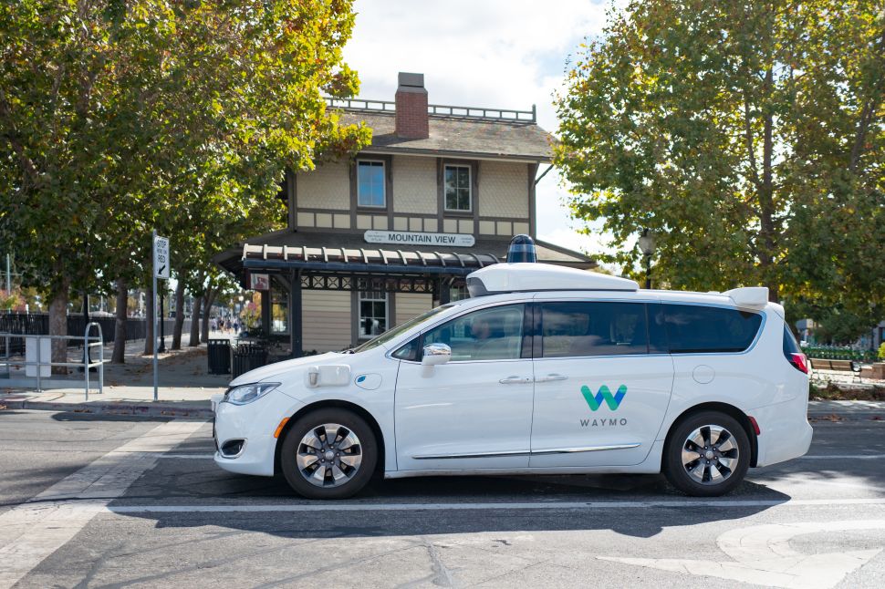 A driverless Chrysler Pacifica minivan operated by Waymo's LIDAR and other sensor units cruise on the roads in Mountain View, Calif.