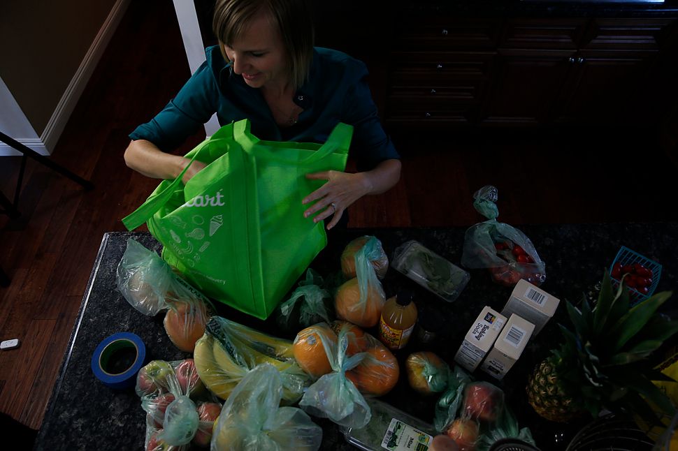 Instacart workers say they're losing out on more cash wages.
