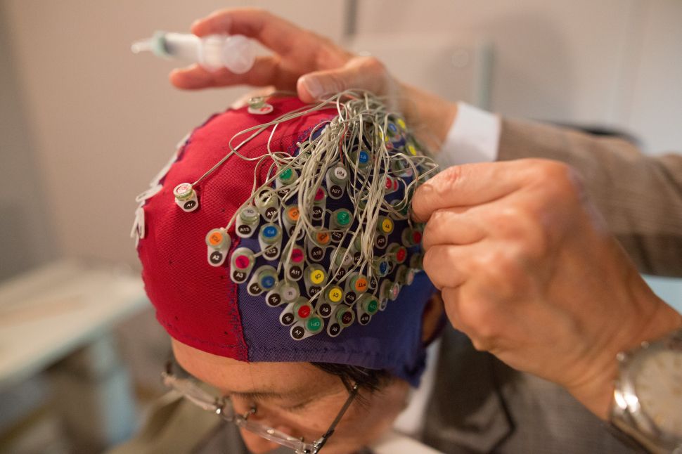 Scientists demonstrate a device capable of reading the human mind through brainwave-detecting electrodes in Japan on April 27, 2017.