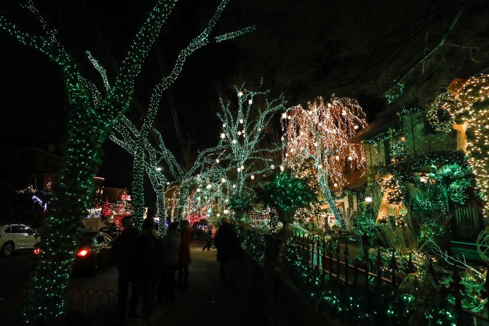 Christmas lights and other ornaments are viewed outside of a home in Dyker Heights, a neighborhood of Brooklyn.