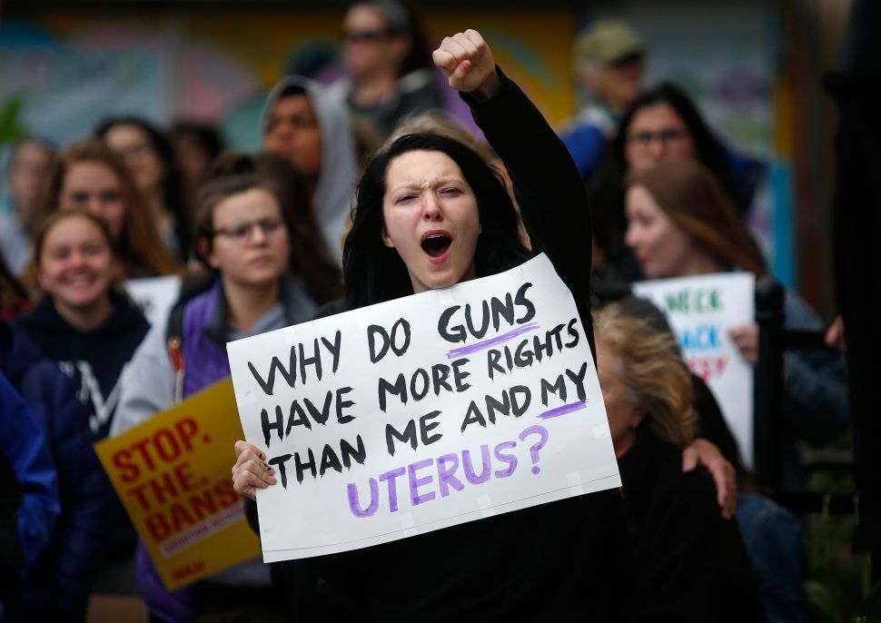 Dylan West, 17, of South Portland reacts to a speaker during an abortion rights rally at Congress Square Park on Tuesday, May 21, 2019.