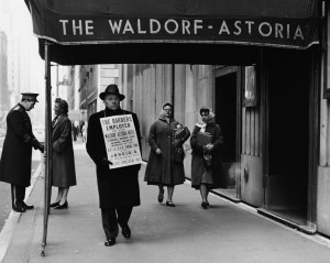A barber on strike outside of the Waldorf Astoria in the 1940s.