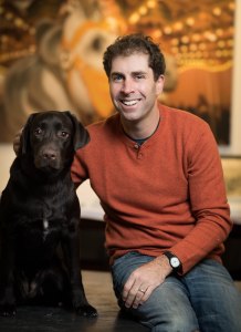 ACT OF DOG: Mr. Walentas with his Labrador Aggie in his Dumbo office (Photo: Francesco Sapienza/for Commercial Observer).