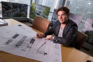 Danish architect Bjarke Ingels talks about his design for 2 World Trade Center in Larry Silvertrein's office in New York, U.S., on Friday, June 12, 2015.  Photographer: Michael Nagle