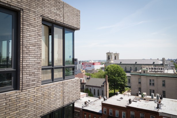 The brick on the exterior of 550 Vanderbilt Avenue is meant to mimic the color and texture of the neighboring church, Co-Cathedral of St. Joseph (Photo: Kaitlyn Flannagan for Commercial Observer).